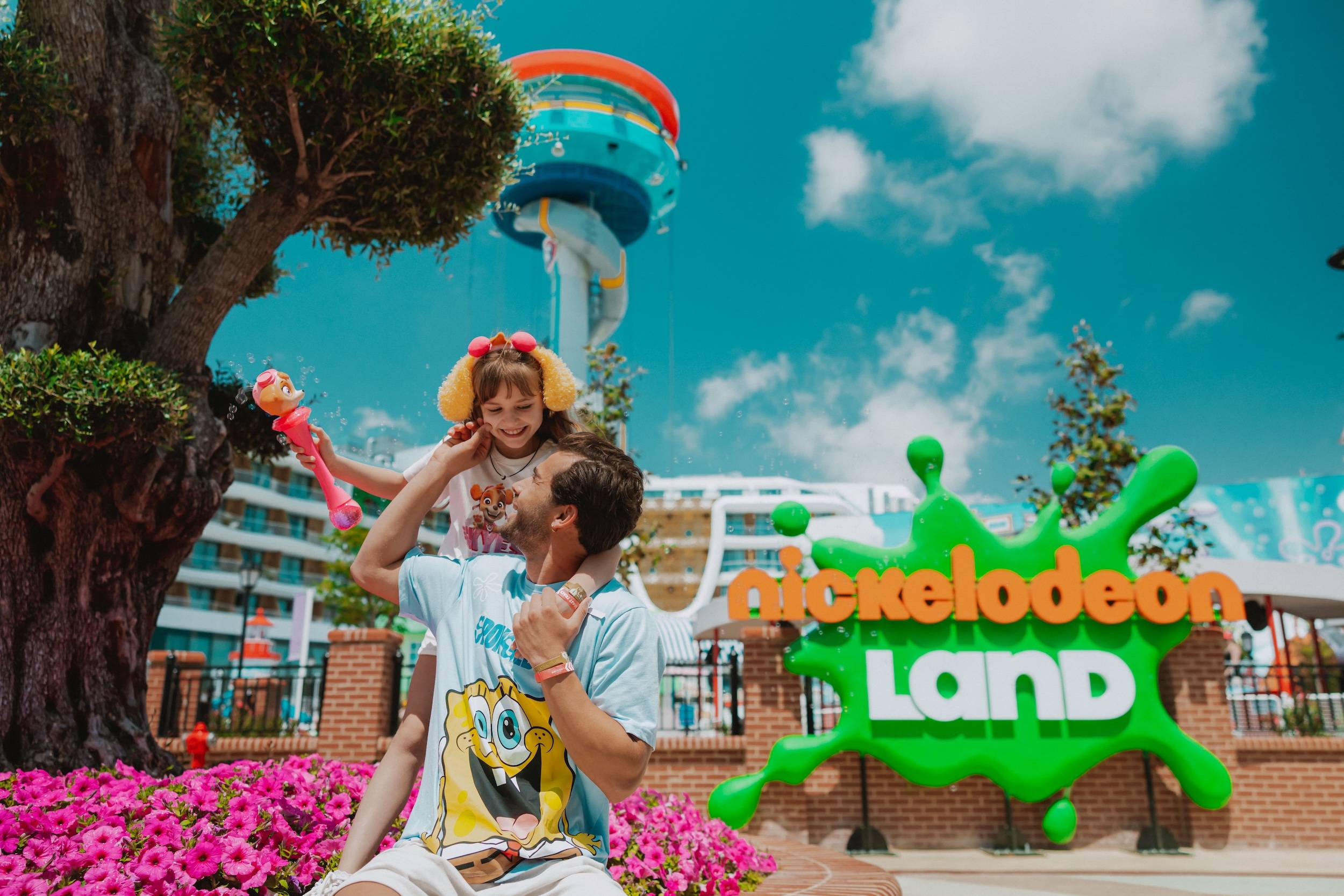 Father and daughter enjoying a fun family day at Nickelodeon Land theme park